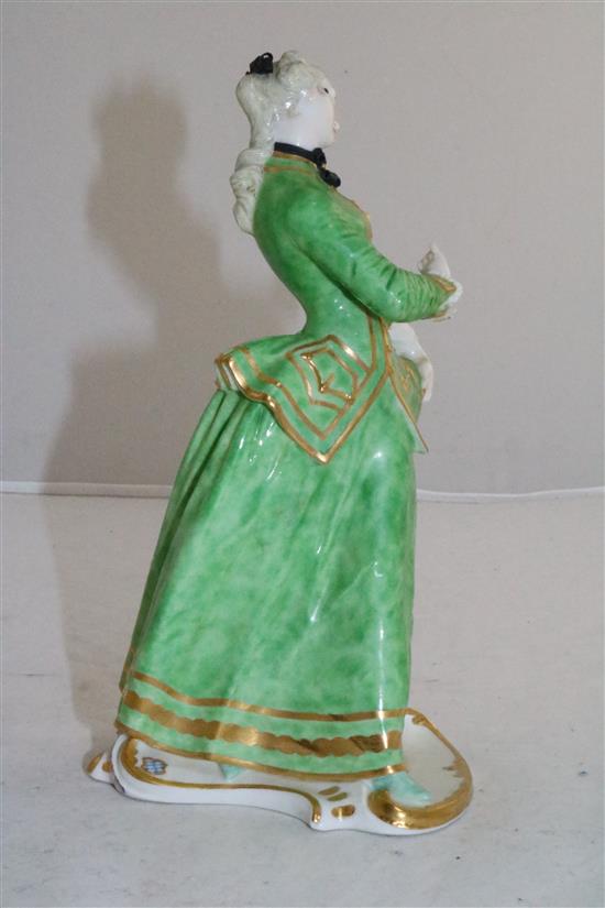 A Nymphenburg porcelain figure of Julia, after the Commedia Dellarte figure by Bustelli, 20th century, height 21.5cm (8.5in.)